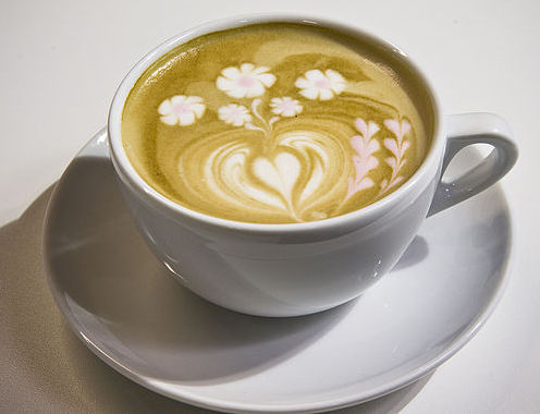 Cappuccino with coloured latte art